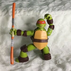 Michelangelo Green and Orange Action Figure Playset - His Weapons Spins